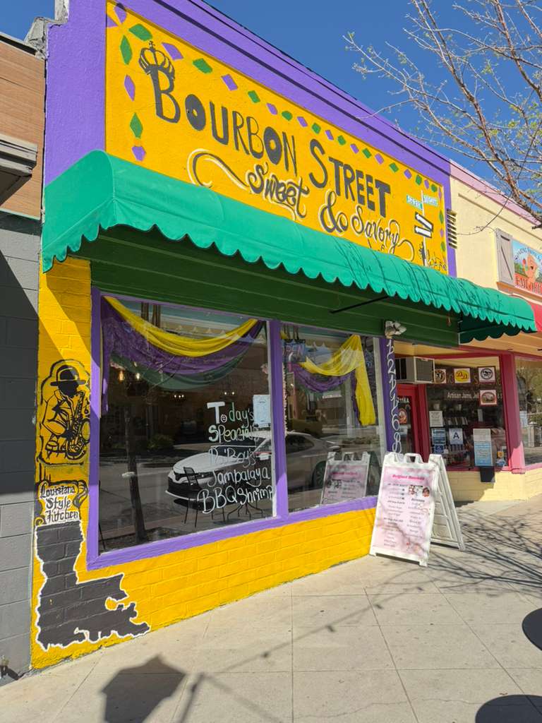 Bourbon Street Sweet & Savory restaurant exterior with a colorful Mardi Gras-themed facade and signage.